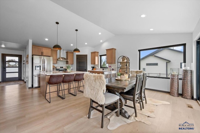 2147 Talisker Ave, Spearfish, SD 57783 - dining area featuring lofted ceiling, light wood-type flooring, and recessed lighting
