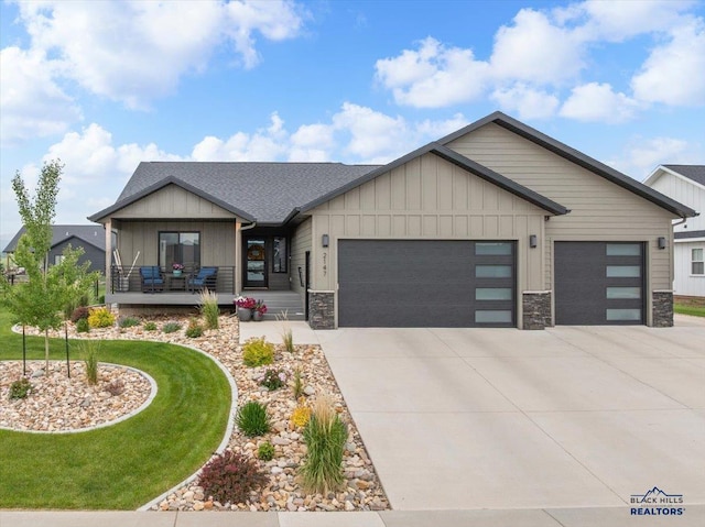 2147 Talisker Ave, Spearfish, SD 57783 - view of front of property featuring an attached garage, driveway, and stone siding