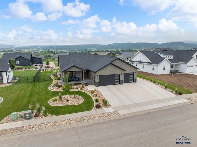 2147 Talisker Ave, Spearfish, SD 57783 - view of front of house featuring a residential view, an attached garage, driveway, and board and batten siding