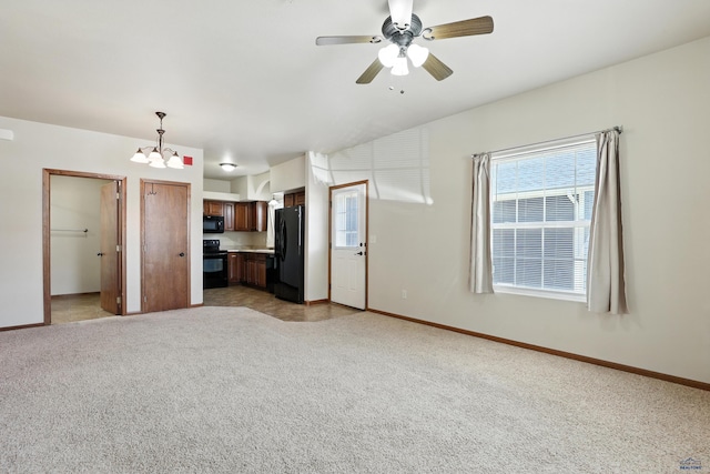 756 Earleen St Unit D, Rapid City, SD 57701 - unfurnished living room with a chandelier, light carpet, and ceiling fan