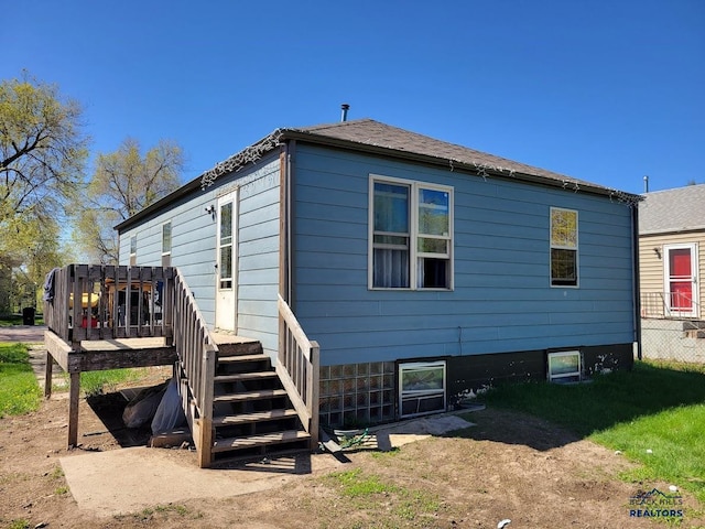 217 E Monroe St, Rapid City, SD 57701 - back of property featuring a wooden deck