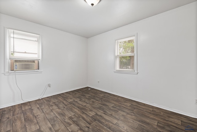 102 E Madison, Rapid City, SD 57001 - spare room featuring dark wood-type flooring and cooling unit