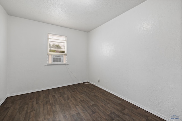 102 E Madison, Rapid City, SD 57001 - unfurnished room featuring dark wood finished floors and a textured ceiling