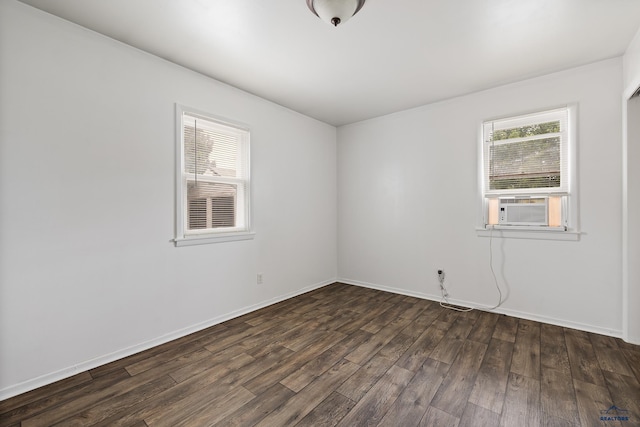 102 E Madison, Rapid City, SD 57001 - spare room featuring plenty of natural light, cooling unit, and dark wood-style floors