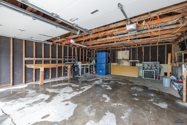 102 E Madison, Rapid City, SD 57001 - garage with refrigerator and a garage door opener