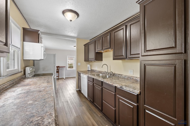 102 E Madison, Rapid City, SD 57001 - kitchen with white appliances, dark brown cabinets, dark wood-style flooring, a textured ceiling, and light countertops