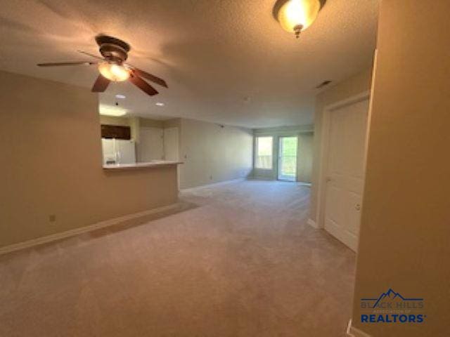 3600 Sheridan Lake Rd Unit # 222, Rapid City, SD 57702 - unfurnished room featuring carpet, a ceiling fan, and a textured ceiling