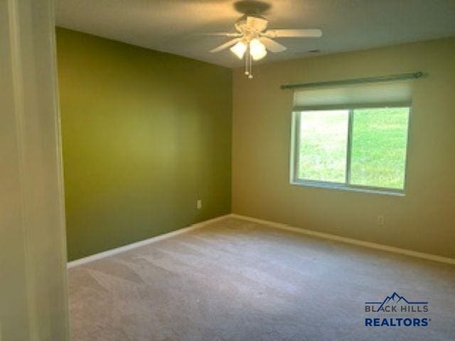 3600 Sheridan Lake Rd Unit # 222, Rapid City, SD 57702 - spare room with a ceiling fan and carpet