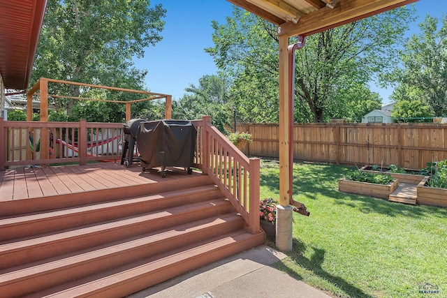 2613 Moose Dr, Sturgis, SD 57785 - wooden deck with a fenced backyard and a vegetable garden