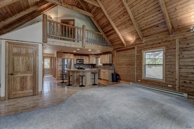 23217 Carbon Loop, Rapid City, SD 57702 - unfurnished living room featuring a baseboard radiator, high vaulted ceiling, light carpet, and a wood ceiling with exposed beams