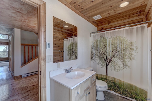 23217 Carbon Loop, Rapid City, SD 57702 - full bathroom featuring a baseboard heating unit, wooden ceiling, vanity, recessed lighting, and a shower with shower curtain