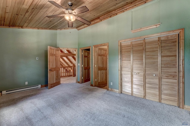 23217 Carbon Loop, Rapid City, SD 57702 - unfurnished bedroom with baseboard heating, wood ceiling, carpet flooring, a ceiling fan, and a towering ceiling