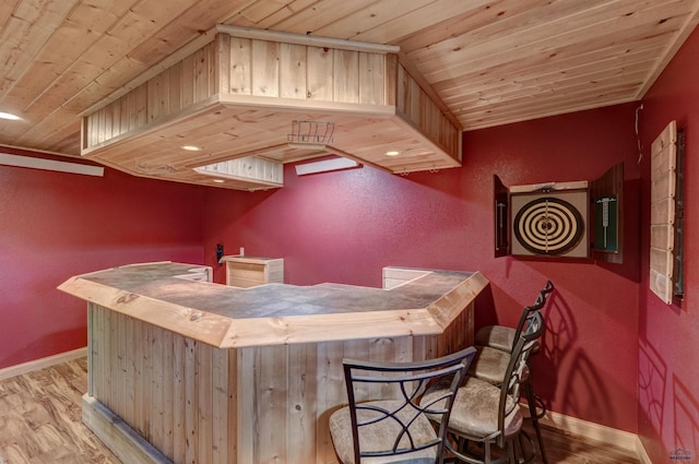 23217 Carbon Loop, Rapid City, SD 57702 - indoor dry bar featuring wood ceiling, wood finished floors, and a textured wall