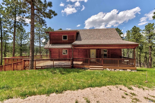 23217 Carbon Loop, Rapid City, SD 57702 - back of property featuring roof with shingles, log veneer siding, a deck, and a lawn