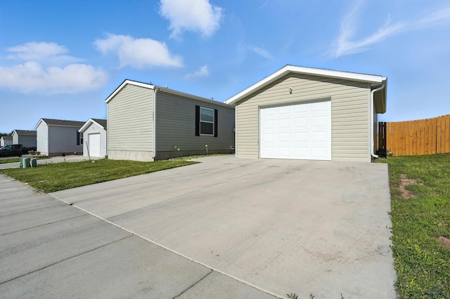 3053 Trailhead Loop, Sturgis, SD 57785 - view of front of home with concrete driveway, an outdoor structure, and a detached garage