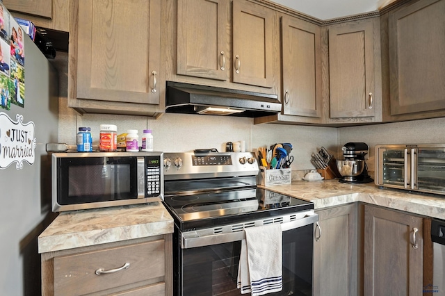 3053 Trailhead Loop, Sturgis, SD 57785 - kitchen with appliances with stainless steel finishes, under cabinet range hood, and light countertops