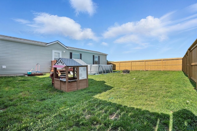 3053 Trailhead Loop, Sturgis, SD 57785 - fenced backyard with a fire pit