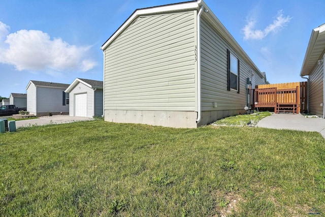 3053 Trailhead Loop, Sturgis, SD 57785 - view of side of property featuring a wooden deck, a lawn, and an outdoor structure