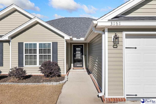 view of exterior entry featuring a garage