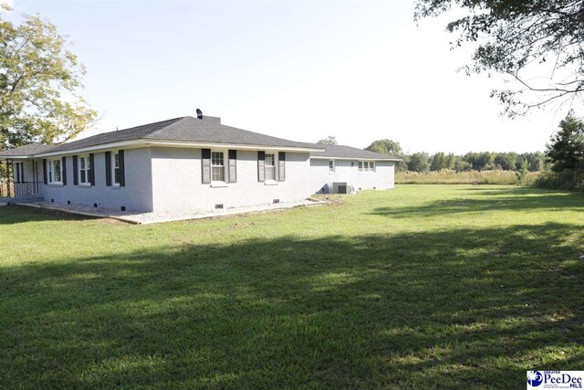 view of home's exterior with a lawn