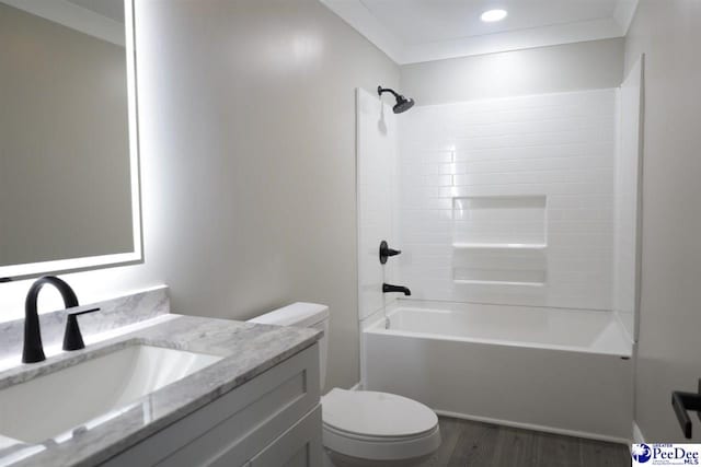 full bathroom with shower / bathing tub combination, wood-type flooring, vanity, toilet, and crown molding