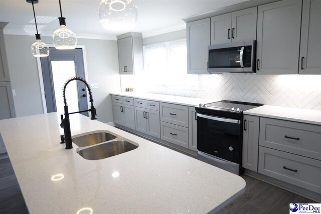 kitchen with range with electric cooktop, crown molding, gray cabinets, and sink