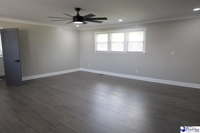 spare room with crown molding, ceiling fan, and dark hardwood / wood-style flooring