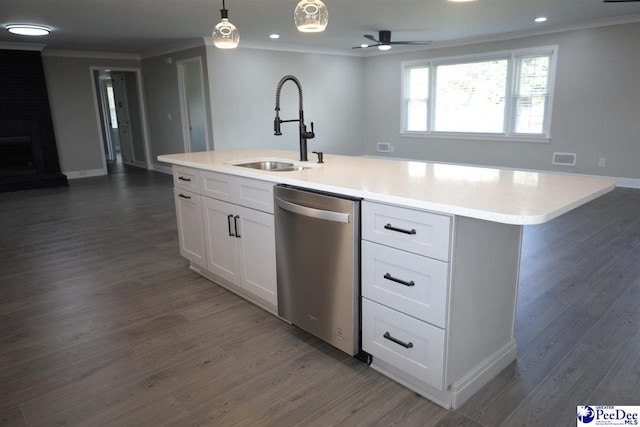 kitchen with sink, decorative light fixtures, a center island with sink, dishwasher, and white cabinets