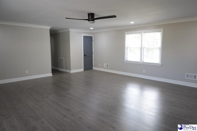 spare room with crown molding, ceiling fan, and dark wood-type flooring