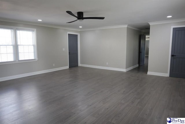 spare room featuring crown molding, ceiling fan, and dark wood-type flooring