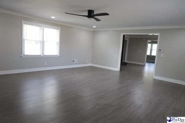 spare room featuring crown molding, ceiling fan, and dark wood-type flooring