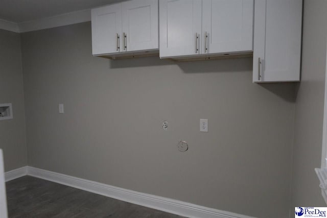 laundry room with dark hardwood / wood-style flooring and cabinets