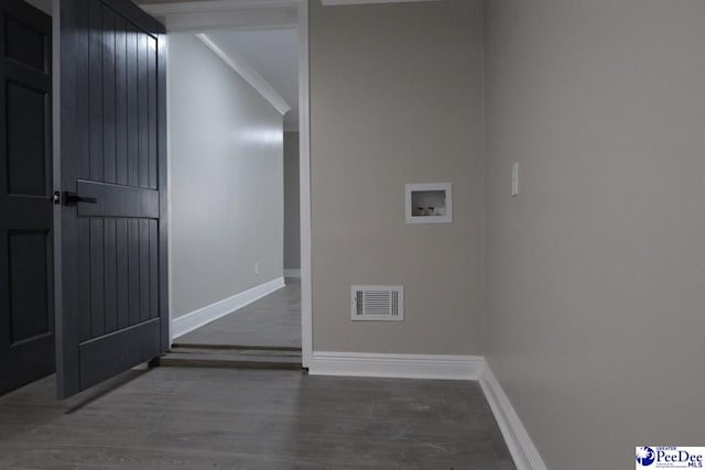 washroom with dark wood-type flooring and washer hookup