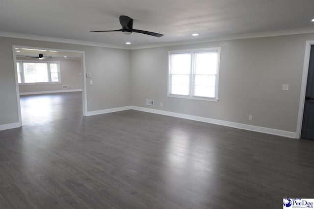 unfurnished room with ornamental molding, dark hardwood / wood-style floors, and ceiling fan