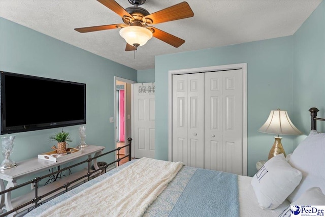 3109 Stillwater Ln, Florence, SC 29501 - bedroom with a closet, ceiling fan, and a textured ceiling