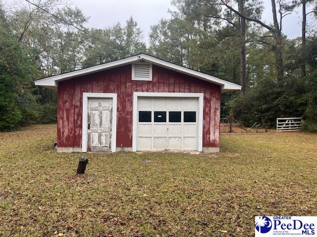 garage featuring a lawn