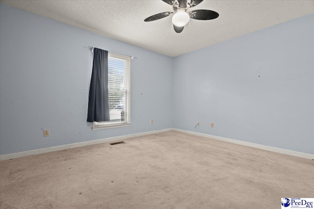 316 Magna Carta Rd, Florence, SC 29501 - carpeted empty room with baseboards, a ceiling fan, visible vents, and a textured ceiling