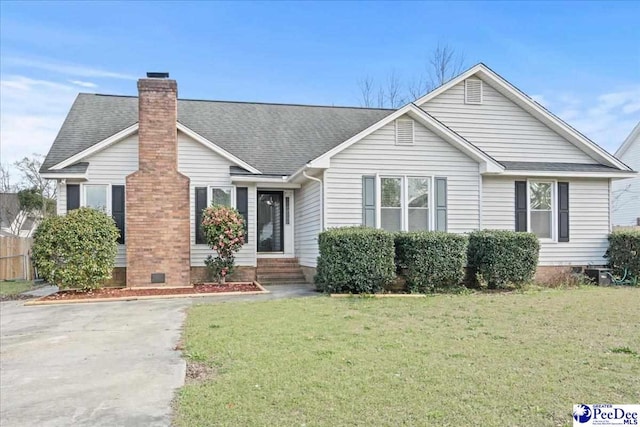 316 Magna Carta Rd, Florence, SC 29501 - single story home with a chimney, entry steps, a shingled roof, and a front yard