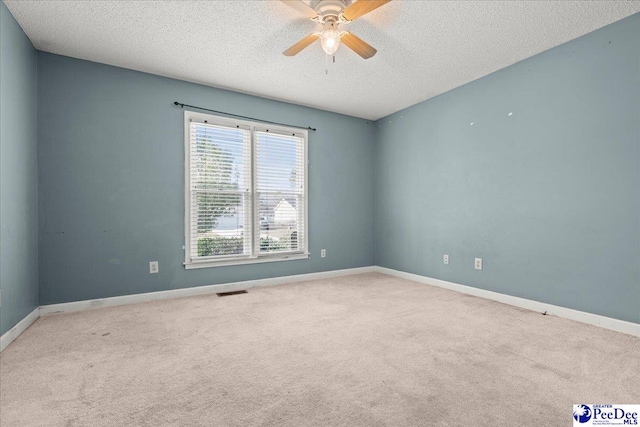 316 Magna Carta Rd, Florence, SC 29501 - carpeted spare room featuring visible vents, baseboards, a textured ceiling, and a ceiling fan