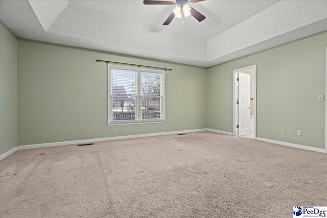 316 Magna Carta Rd, Florence, SC 29501 - carpeted empty room featuring a raised ceiling, a ceiling fan, baseboards, and a textured ceiling