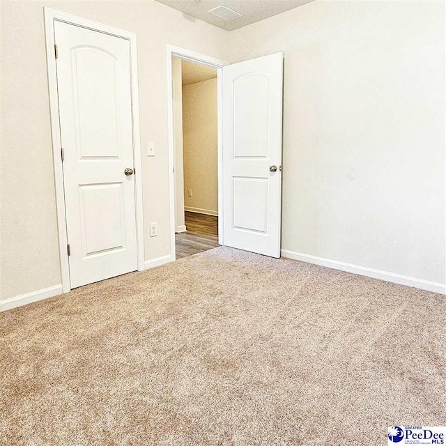 822 Twin Oaks Cir, Lake City, SC 29560 - unfurnished bedroom with carpet flooring and baseboards
