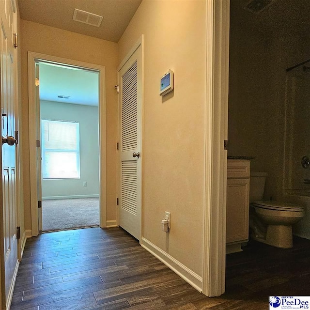 822 Twin Oaks Cir, Lake City, SC 29560 - hallway featuring baseboards and dark wood-style flooring