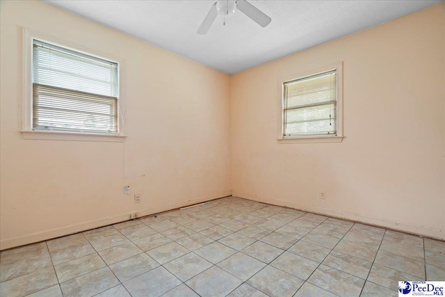 410 N Salem Dr, Florence, SC 29506 - unfurnished room featuring ceiling fan, baseboards, light tile patterned floors, and plenty of natural light