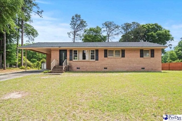 410 N Salem Dr, Florence, SC 29506 - ranch-style house featuring an attached carport, fence, crawl space, a front yard, and aphalt driveway
