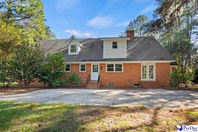 rear view of property featuring a patio area