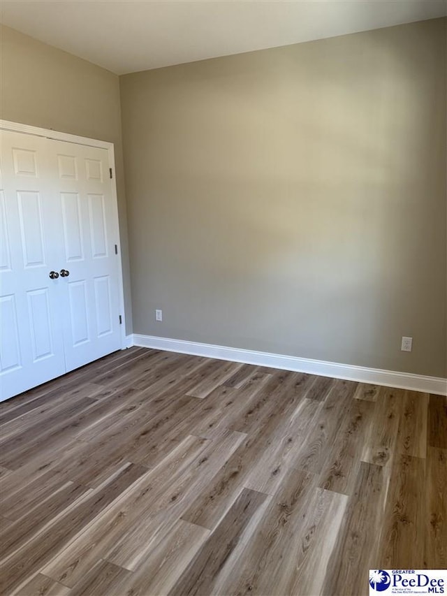 unfurnished bedroom featuring wood-type flooring