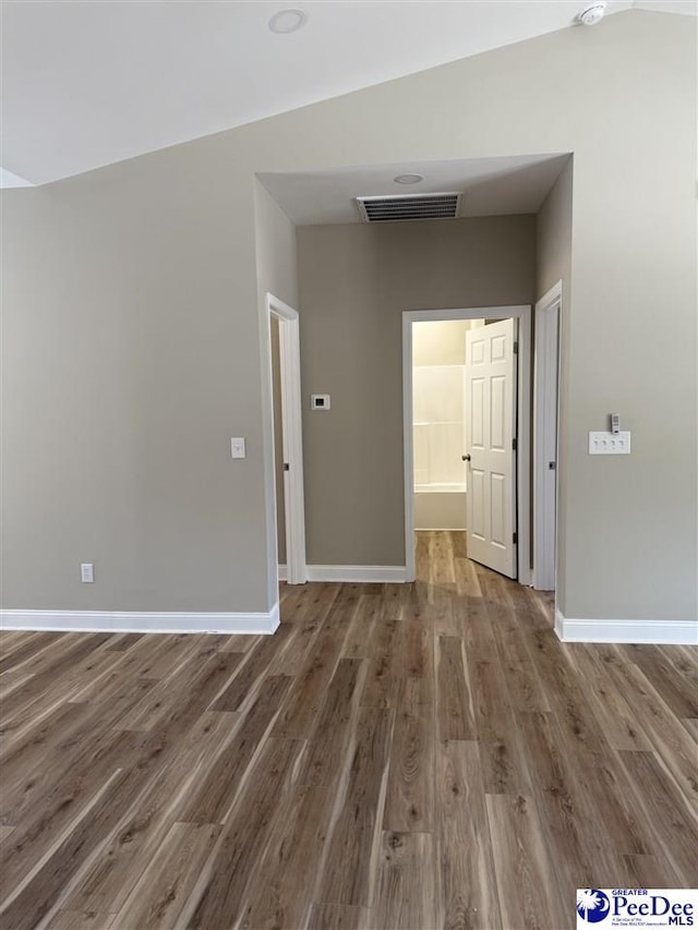 unfurnished room with hardwood / wood-style flooring