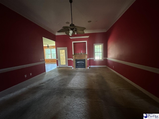 unfurnished living room featuring plenty of natural light, concrete floors, and ceiling fan