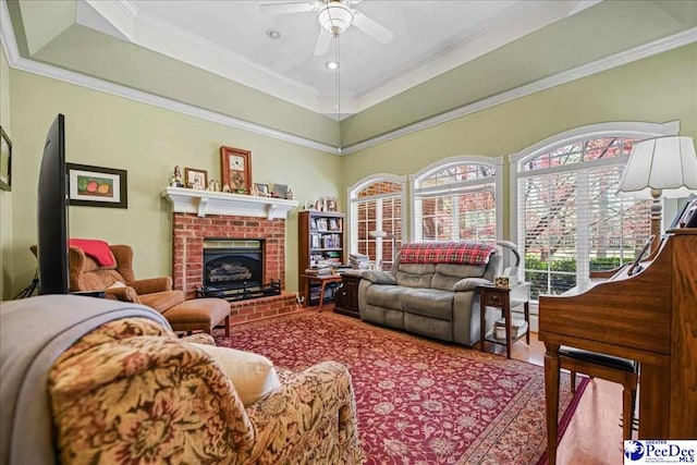 1020 Bentwood Rd, Hartsville, SC 29550 - living area featuring a ceiling fan, crown molding, and a fireplace