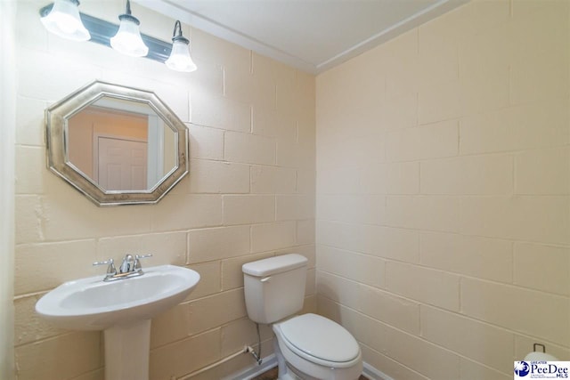 bathroom featuring toilet and a sink